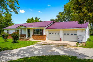This picturesque farm has so much to offer. The updated home is 1568 sq ft with 3 spacious bedrooms, 1 bathroom,2 car garage and a covered back porch. Additionally, there is a 30 ft X 50 ft workshop equipped for welding, an out-building for the animals, 100 ft. x 130 ft.pen. The HVAC is only year old and the metal roof is 3 years old. This property is lockated just 25 miles from Branson, MO. and 5 miles from the Enon boat ramp at Table Rock Lake. Also offered with 77 acres MLS 142241, or just the 61 acres MLS 142249