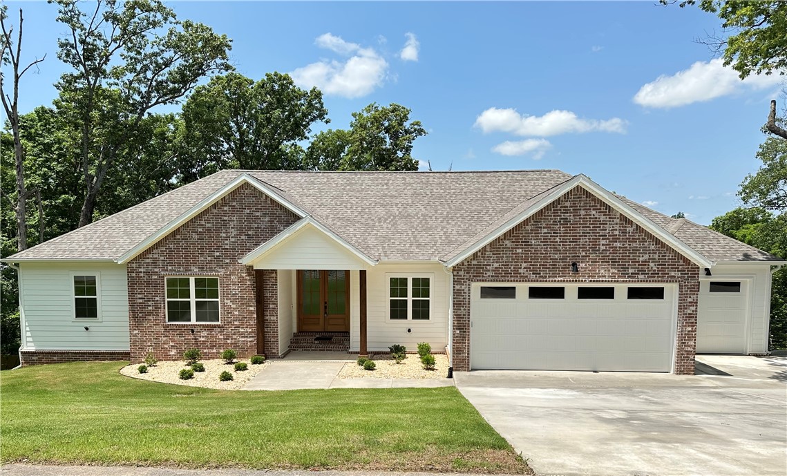 Welcome to Shelby Forrest, A quiet, wooded subdivision with large lots and beautiful settings. This new construction home situated on nearly 2 acres features an open floor plan, gorgeous countertops, custom cabinets, hardwood floors throughout, 4 bedrooms and 3 full baths. The 4th bedroom serves as an ensuite with its own private bathroom. Enjoy the outdoors on the large covered deck. Centrally located just a few minutes from the center of Pea Ridge, 10 minutes to downtown Rogers and only 15 minutes from downtown Bentonville. Seller will pay $10,000 towards buyer closing cost