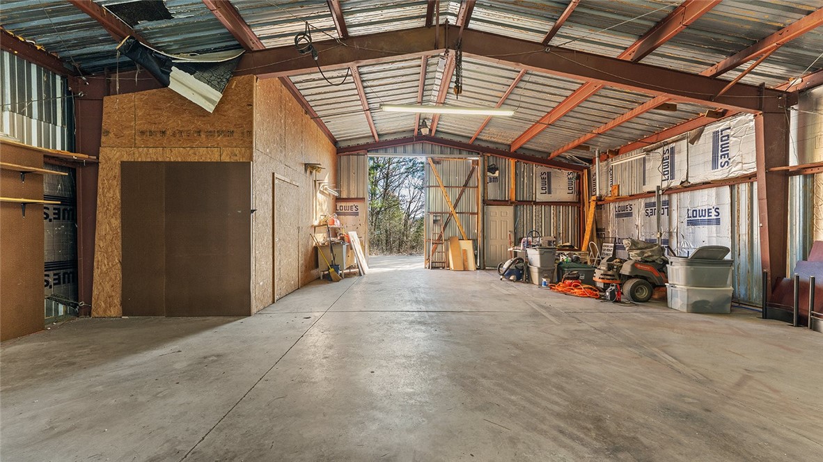 Unmatched flexibility! 1-acre commercial property just minutes from Steelworx HQ & new Commerce Park Extension. 2,400 sq. ft. warehouse/workshop w/ oversized doors + 1,080 sf attached office/apartment + separate 800 sf cottage. Setup perfect for business owners, investors, or creatives seeking versatile space to grow. Strong income potential: Office/apartment lease comps @$1,400/mth, 800 sq. ft. cottage @$1,000–$1,200/mth =potential $2,600/mth through com or res leases - not including warehouse space. Live & work on-site OR rent one or both spaces for steady cash flow OR operate multiple businesses w/ separately metered utilities. Fully fenced backyard w/ deck and built-in grill ideal for after-hours gatherings. Additional features: Rewired to code. Room to expand—potential to add a third structure or increase parking. High-visibility road frontage for future development. Now $434,000—priced below market value! Some photos staged to depict residential and/or office concepts. Red property lines for reference.