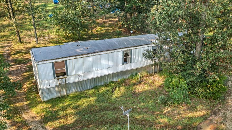 Great opportunity for someone looking for small acreage close to Prairie Grove, 2.2 ac mol with a singlewide - there is no known info (or very little) on the singlewide mobile. The mobile was inherited, wooded/partially wooded acreage. There is water/septic in place already. There is a camper on the property as well (available for additional amount). This property is ready for a move in or to build a dream home close to town but out of city limits. Mobile is included, but is being sold as-is with no knowledge.