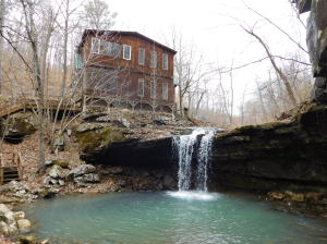 CABIN | WATERFALL | NEWTON COUNTY | BORDERING OZARK NATIONAL FOREST This one of a kind 40 Acres and log cabin home is built overlooking a waterfall. Cabin is at the end of the county road in the Wayton community built on Dog Branch which is the headwaters of the Little Buffalo River. Cabin has wood fire place, central heat/air, and back up propane generator. Awesome patio and walk way.