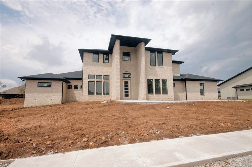 New construction masterpiece... Estate home in the highly sought after gated community of Scissortail. 4 car garage, large bedrooms with walk-in closets and their own bathrooms, bonus room with wet bar on the main level and loft/bonus room upstairs. Large open floorplan with TONS of natural light and space to entertain! STUNNING his and hers bathroom suits with walk through tile shower, his and hers walk-in closets, TWO separate toilet area AND morning bar. Office and formal dining room with easy access to the kitchen. Secondary bedroom on the main level with luxurious bathroom. All the features you want including home audio, central vac, Jenn Air appliances with a 6 burner cooktop, griddle, ice maker, sub-zero stand alone fridge and freezer and double ovens. SECOND master bedroom on the main level with hardwood floors, bathroom suit and walk-in closet. Enjoy entertaining on the large covered back patio with built in grill!