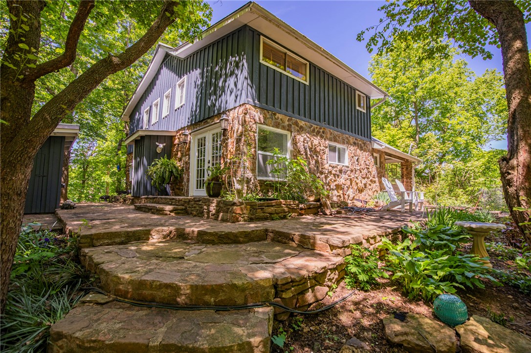 This gem of a property is pure enchantment. Nestled on 2.61 acres on Mt. Kessler, this charming, light-filled native stone home has everything you'd want, and more. On the outside, the nature, serenity and view will make you never want to leave. The inside has been lovingly remodeled and updated while keeping the character and history of the home in mind. The back and side porches are great outdoor spaces for entertaining or relaxing. The roof on the carport is a living roof - just look out the study window and you will see what I mean. The 40 x 50 foot barn is huge, has a concrete floor and offers plenty of storage. And did I mention that you're just steps away from walking and bike trails? If you want to be in town, yet live in the middle of a nature sanctuary that is truly zen-like, come and experience all this property has to share.