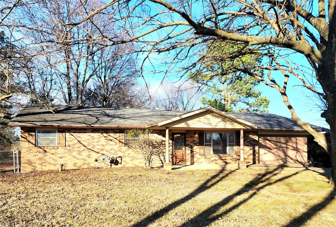 This home is a large ranch style home that has belonged to this family for some time. It has two full acres. The back acre is completely fenced in and was once a hobby farm of sorts for a few pet animals. It once had a small orchard started. The family would love to see it back to its prime. It has three bedrooms and two baths. There is a large two car garage and a side covered parking for mowers or one car. There are two out buildings for storage or could be made into a workshop. The back of the house was an expansion that offers many windows and options for family space. The home is being sold as is. It is part of a trust. There is no disclosure due to the trustee has not lived in the home but can share any information they do have. The home has water with Washington County but has a septic system for sewer. It has great space and lots of potentional. It is ready and waiting for its new owners to come and love it as much as it's current family has.