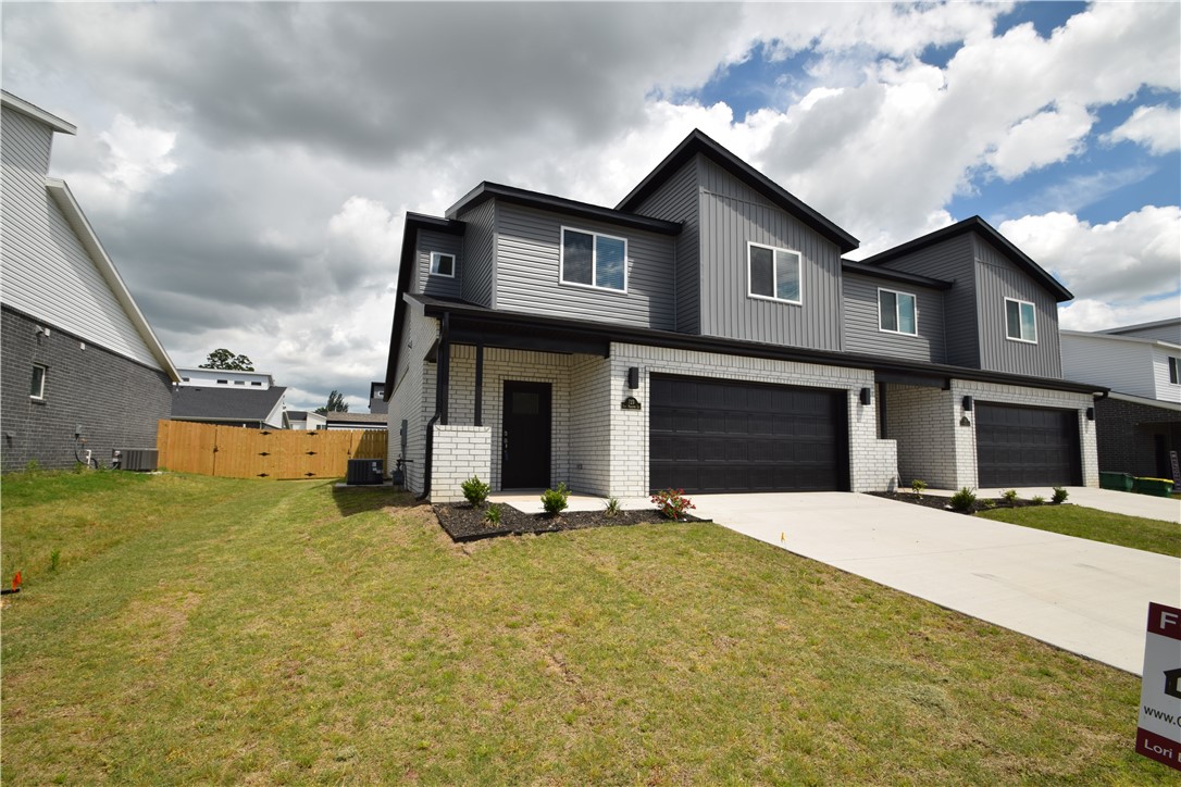 New modern design duplex in the heart of Centerton and close to Schools! Also included brand new side by side stainless refrigerator, washer and dryer. This 3 bed 2 1/2 bath plan has a open living concept with tall ceilings and tons of natural light. Kitchen has granite countertops, stainless appliances, a large pantry, and a gas range. Primary bedroom is on the main floor and has walk-in closest. Two bedrooms upstairs with full bath and landing area. Luxury vinyl plank flooring throughout the 1st floor, 2" faux wood blinds, extra storage in the upstairs attic. Property has a private back patio and wood privacy fence. Owner must approve pets and no smoking.