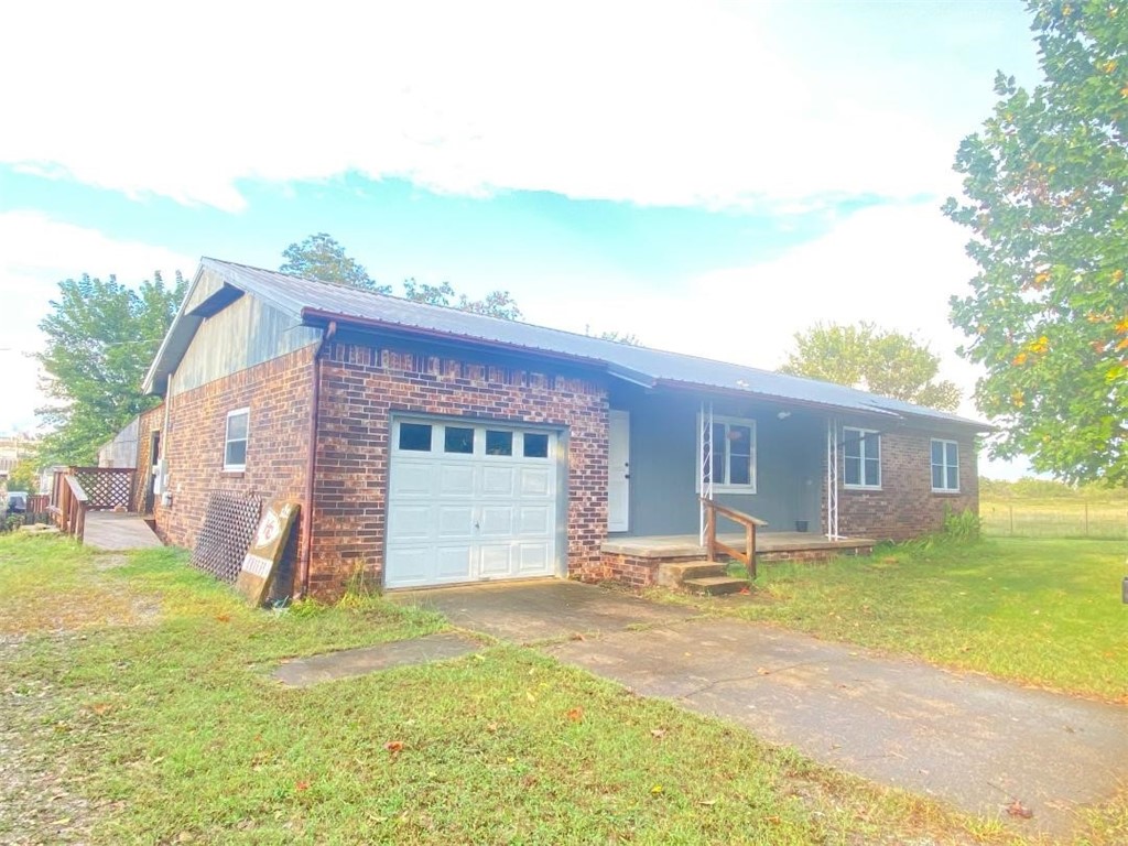Charming and loads of living space! This warm and comfortable home is a must-see, perfect for a starter or investment property. Located on a desirable corner lot in a wonderful neighborhood, it's just a short walk to Tyson and the Green Forest School District. Enjoy entertaining in the outdoor area, featuring three enclosed porches, and take advantage of the included hot tub. Don’t wait—schedule your visit now and make this property yours before it's gone!