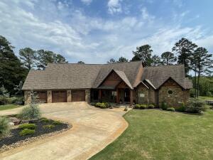 Executive excellence meets rustic mountain retreat, all in Russellville's finest neighborhood. Boasting of today's most wanted amenities while still keeping that cozy cabin feel. Sprawling over 7500+sqft, this home would make AV geeks envious with its control 4 technology & remote lighting/ security, full surround sound, & so much more. Enjoy views of Mt Nebo while sipping coffee from your cozy breakfast nook then simply raise your custom Hunter Douglas blinds in the afternoons to enjoy some of the most beautiful sunsets while you dine. Finish off the evening with cocktails on the large deck under the stars. The Kosher rated Chef's kitchen was featured in ''At Home Arkansas'' magazine. Thermador appliances, leathered granite, warming drawers, and walkthrough pantry. Truly a paradise