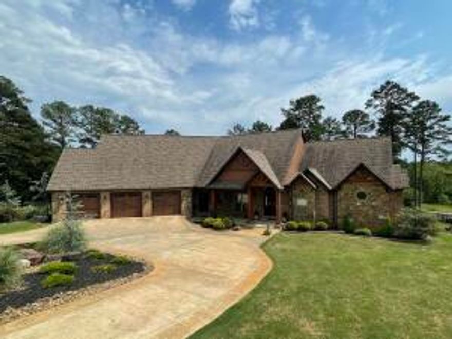 Executive excellence meets rustic mountain retreat, all in Russellville's finest neighborhood. Boasting of today's most wanted amenities while still keeping that cozy cabin feel. Sprawling over 7500+sqft, this home would make AV geeks envious with its control 4 technology & remote lighting/ security, full surround sound, & so much more. Enjoy views of Mt Nebo while sipping coffee from your cozy breakfast nook then simply raise your custom Hunter Douglas blinds in the afternoons to enjoy some of the most beautiful sunsets while you dine. Finish off the evening with cocktails on the large deck under the stars. The Kosher rated Chef's kitchen was featured in ''At Home Arkansas'' magazine. Thermador appliances, leathered granite, warming drawers, and walkthrough pantry. Truly a paradise