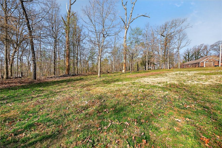 Welcome to this well-located lot in Bella Vista to build your personal home or investment property. Perfectly positioned in one of Northwest Arkansas’s most desirable communities, just a short walk to Branchwood Recreation Center, nearby golf courses, and scenic bike trails, making it easy to embrace the area’s active outdoor lifestyle. Surrounded by natural beauty yet conveniently located 5 minutes from I-49 and just minutes from Bentonville, this lot offers the perfect blend of convenience and a blank slate. Lot is subject to $16/month POA dues (buyer due diligence for details). Home next door is not included in the price of the lot, but it is offered for sale on a separate listing - MLS#1340644, 3 Eyemouth Dr.