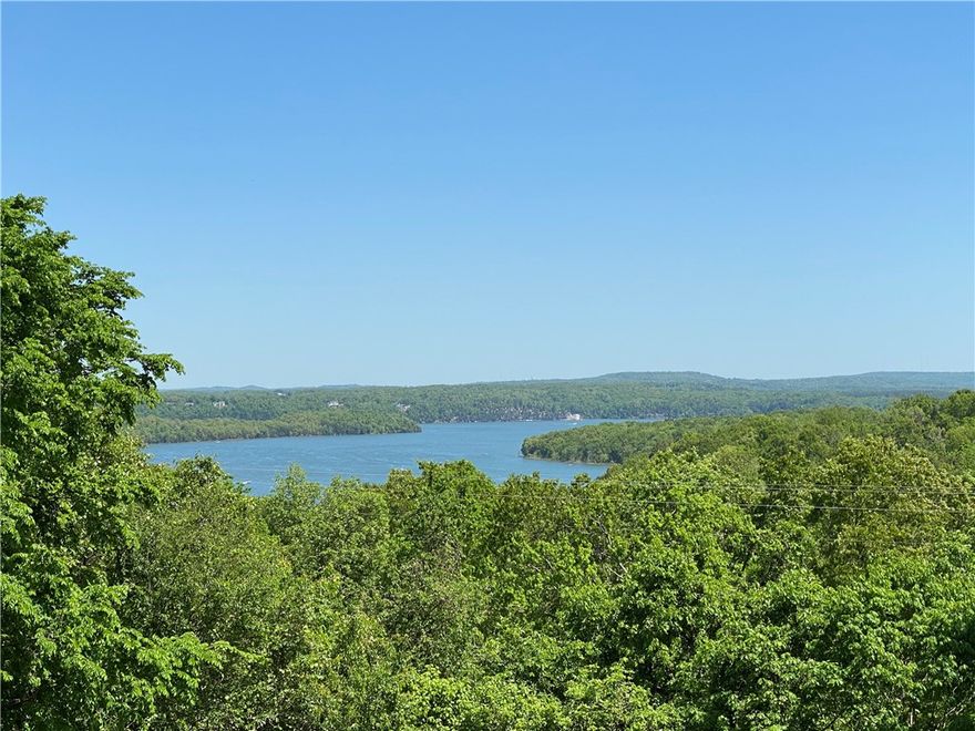 Optimized for privacy and breathtaking year-round Beaver Lake views from almost every room! Freshly painted 960 sq. ft. covered upper deck with hot tub and 775 sq. ft. covered lower deck.  2 minutes from the Beaver Lake beach and boat ramp. 8 minutes to Prairie Creek marina. Updated and gorgeous home with sizeable rooms and a logical flow layout.  Each level has its own master bedroom suite, family room, and wet bar!  Spacious kitchen with a stunning lake view, additional large bedrooms, weight/theatre room, and an expansive laundry/pantry/mudroom.  The home is built on a solid concrete foundation and has an enormous 4-car garage.  Updates include: a new roof, new appliances, moldings, all-new paint, hardware, light fixtures, new garage doors, new gutters with leaf screens, professional landscaping, and the list goes on!