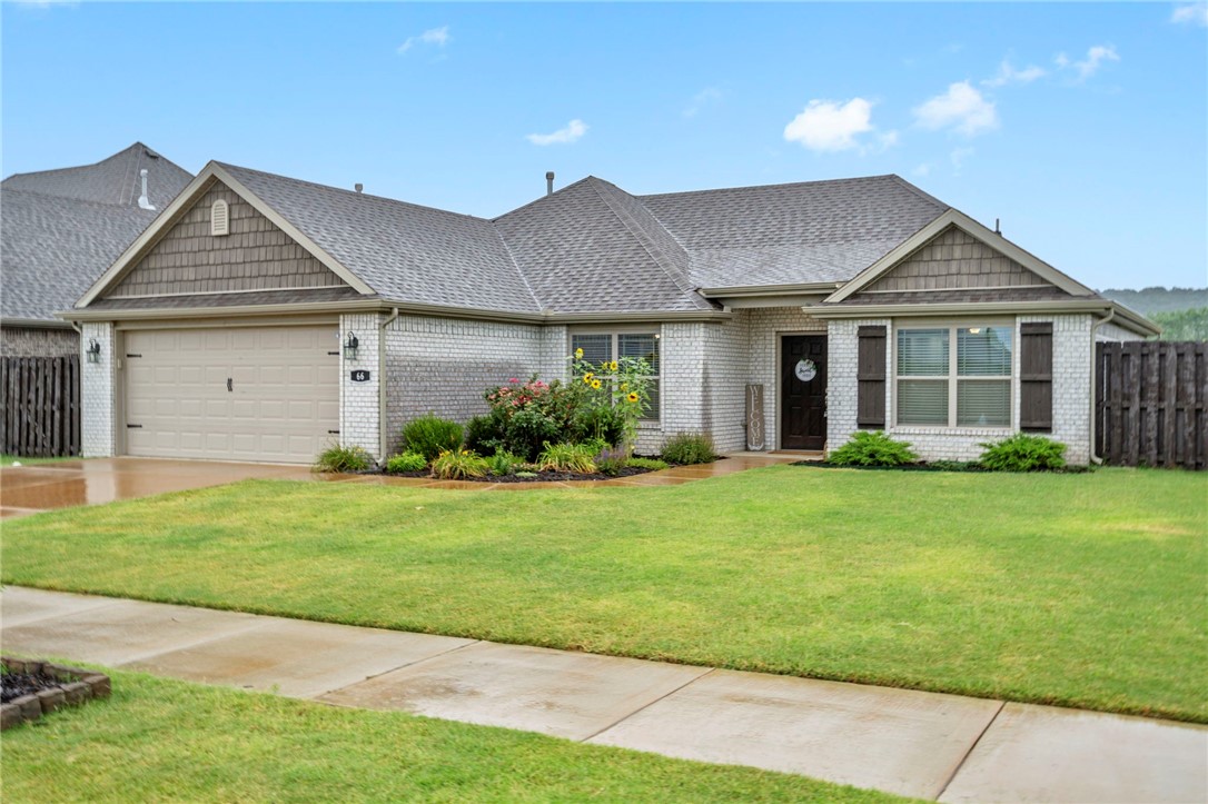 Imagine starting your mornings on a spacious 500 sq ft back porch, soaking in the sunrise over Kessler and Millsap Mountains in Fayetteville. Step back into a bright, contemporary home with a perfectly designed split 4-bedroom floorplan. Located just 4 minutes from Hwy 49 and 10 minutes from the U of A, this home combines convenience with serene mountain view living. The kitchen is a chef’s dream, featuring granite countertops, a gas range & a GE refrigerator—all ready for move-in. The primary suite is a true retreat with tray ceilings and expansive mountain views through large windows. The en-suite bath includes dual granite vanities and a generous walk-in closet. Need a home office? The 4th bedroom is perfectly suited for it, complete with elegant glass French doors. Beautiful landscaping with tall sunflower plants greets you in the front yard, while the fully fenced backyard is pet-ready and offers plenty of space to relax or entertain. This home is truly move-in ready! Washer/dryer/fridge convey.