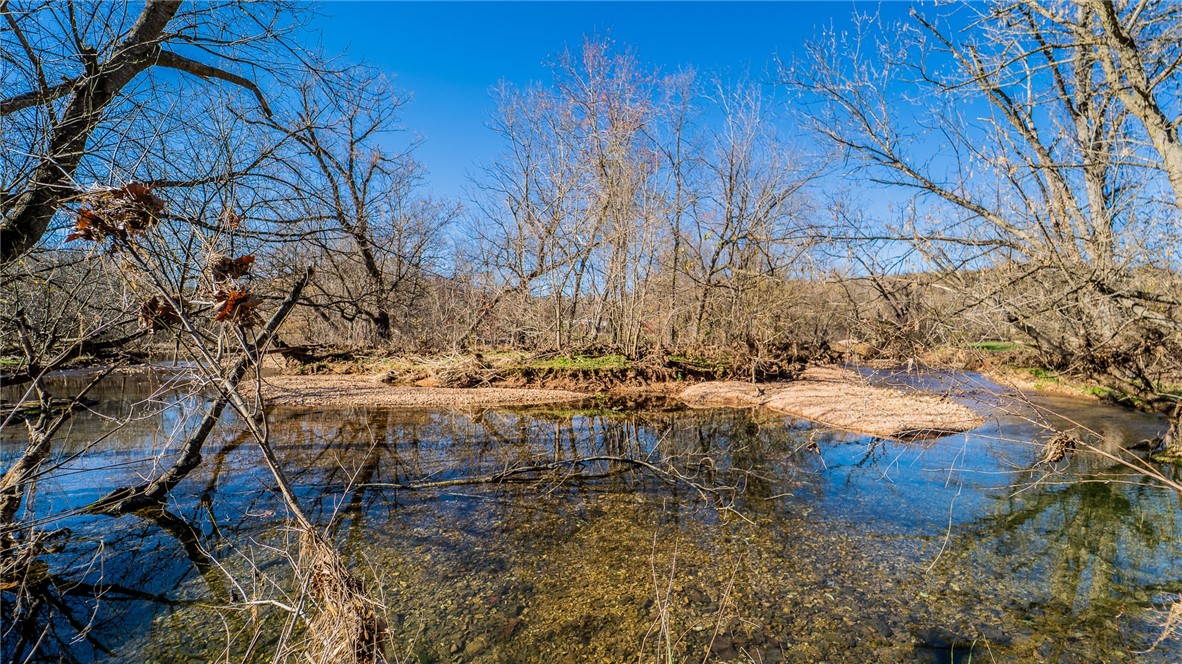 Let's talk about a view! Have you been looking for something that has a gorgeous view or a place to run
cattle? You've found it! This property has a beautiful year round creek that runs through it as well. Land is
being sold per acre so final purchase price will be determined by new survey.