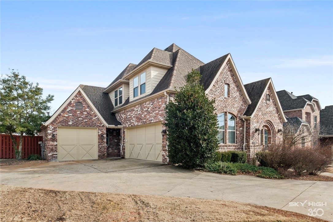 Beautiful European brick home in the Turnberry at the Peaks subdivision, this location cannot be beat. Close to Promenade Mall, Top Golf, The AMP, and so much more. The grand curved staircase and upstairs balcony open to the 2 story Entryway and formal dining room below. Beautiful Hardwood Floors thoroughout main living areas. This home has 4 Bedrooms, Bonus Room, Executive Office and 3.5 Baths. Master Suite downstairs has gorgeous master bath with garden tub and separate walk in Shower. Gourmet Kitchen with Island has granite counters and stainless steel appliances. Enjoy your morning coffee or evening cocktails on the covered patio that extends to the outdoor living space complete with Hot Tub and outdoor fireplace. This one will not last long.