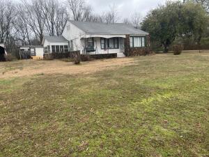 What a potential for this cute house on the hill.