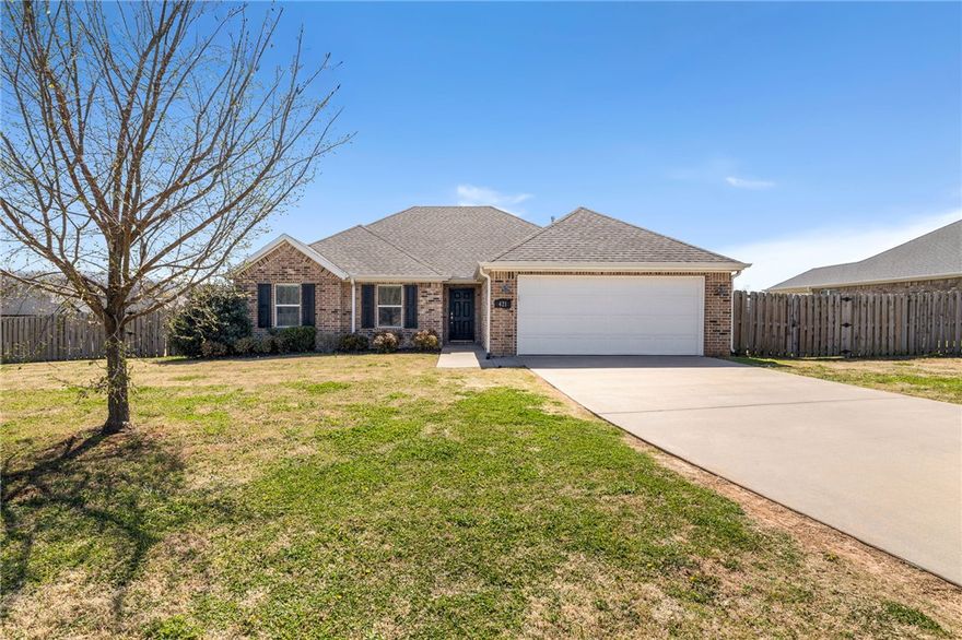 This move-in ready home offers comfort, space, and thoughtful design. Featuring a desirable split floor plan, the layout provides privacy for the primary suite while keeping the main living areas open and inviting.

The living room welcomes you with soaring cathedral ceilings accented by beautiful beams, creating a warm and spacious atmosphere perfect for relaxing or entertaining.

Situated on a generous corner lot, the outdoor space offers plenty of room to play, entertain, garden, or simply spread out and enjoy.

Conveniently located just 1.3 miles from Farmington High School and less than a mile from Highway 62, this home provides easy access for daily commutes while still enjoying the comfort of a neighborhood setting.

With its functional layout, charming architectural details, and great location, this home is ready for its next owners to move in and enjoy.