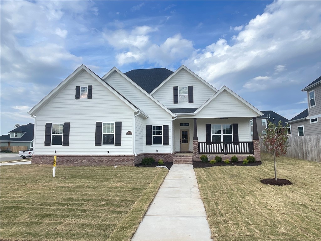 New construction home in desirable area in SW Rogers! It features 4 BR plus bonus room /3 car garage. Downstairs has open concept in the living and kitchen area. Kitchen is equipped with gas cook top, built-in oven and microwave, large island, pantry, and eat-in dining. Primary bedroom and bedroom 2 are on main level with a spacious bath and closet. Upstairs has bedrooms 3-4, a full bath, and bonus room.