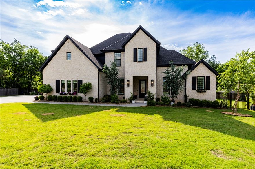 Stunning estate home in The Enclave - this property has it all and is summer ready! Positioned in a quiet cul-de-sac, the .58 acre lot provides a private retreat just minutes from Don Tyson Parkway. Expansive living space perfect for indoor/outdoor entertaining, main level primary, with an additional bedroom and en-suite, private office, formal dining, 4 car garage, utility room and a gourmet kitchen round out the main level. Upstairs includes 2 additional bedrooms, both with en-suite baths and walk-in closets, plus an oversized bonus room. This home offers an incredible setting for everyday living and memorable gatherings with family and friends. Schedule your showing!
