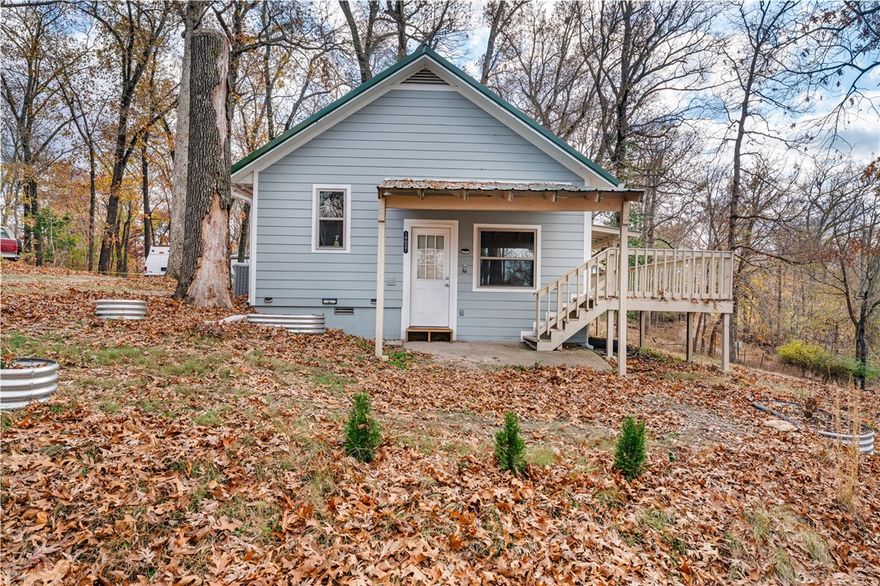 Nestled on a quiet, wooded corner lot, this charming two-bedroom, one-bath home offers a peaceful retreat with a perfect balance of privacy and convenience. Minutes from nearby trails, shopping and dining, it provides easy access to everyday necessities and outdoor recreation. Inside, the eat-in kitchen flows into a cozy living area, creating a warm, functional space ideal for daily living or entertaining. The single-story layout is easy to navigate and low-maintenance, with HVAC, appliances, plumbing, electrical, and flooring all essentially new, making it perfect for first-time buyers, downsizers, or investors plus a storage building with 220V and 110V power adds potential for a workshop, hobby space, or extra storage. An additional 0.25-acre lot is also available, offering flexibility to build a dream shop, expand outdoor space, or hold as an investment. With its inviting setting and added land, this property blends location, value, and potential ready for your personal touch.