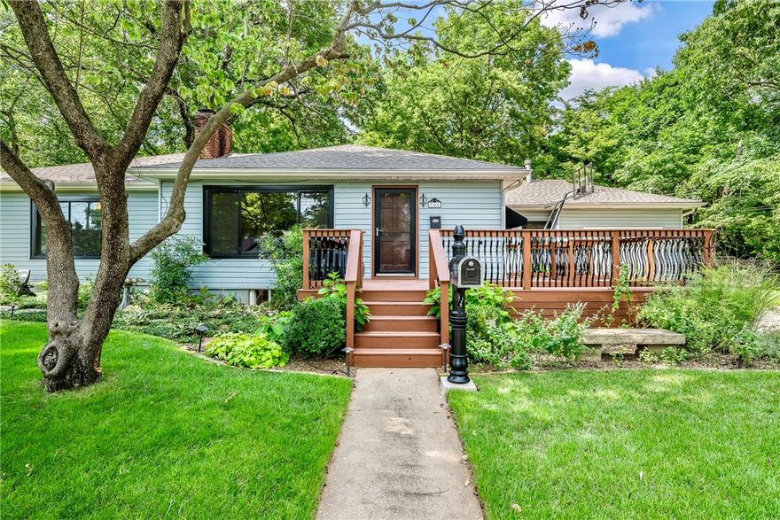 This charming and spacious Wilson Park home fulfills many must-haves such as having the Primary Bedroom on the main level, a level backyard, a variety of outdoor living spaces including a large screened-in porch, and within walking distance to Wilson Park, UofA, VA, & Razorback Greenway.  Featuring the timeless charm of original built-ins and hardwood floors with modern updates such as all new windows and updated electrical, water & sewer lines.  2 bedrooms, 1 bath, and a large flex room are located on the spacious 1710 SF main level while 1 bonus rooms & 1 more bath are located in the fully remodeled 622 SF basement.  Side access door convenient for using basement for guests.  1-car garage attached with access to the interior.  Extensive, professional drainage & landscape improvements completed 2021.  Roof installed 2018, HVAC 2016.