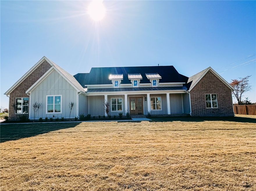 This is the one you've been waiting for, because We've made sure all of the boxes are checked! This stunning modern farmhouse sits on 1.01 level cleared acres in Bentonville School District. It is centered around outdoor living with an impressive outdoor kitchen and fireplace. Once inside, you'll be pleased to notice the attention to detail and find that the upgrades persist in revealing themselves. From 10' and higher ceilings throughout the main level, 8' doors, custom cabinets with white oak features, large format tile accent walls, quartz countertops, custom showers, the linear fireplace, and custom tile work it may be easy to overlook the double oven, built in ice maker, pot filler, microwave drawer, farm sink, led mirrors, underground storm shelter, insulated garage with epoxy floors and ultra quiet openers, and so much more. These are a few of the features you will find in this home and the other available homes in Wynnbrooke Estates! The pictured pool is a 35' Pinnacle Pool by Leisure Pools.