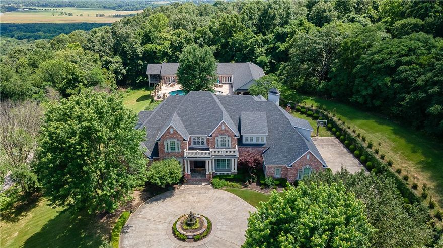 Absolutely incredible opportunity to own an exquisite East Fayetteville estate that is situated on 2.11 private acres at the end of a cul-de-sac.  The main home features 6,591 heated and cooled sq ft  and offers 5 bedrooms, 4 full bathrooms, 2 half bathrooms, open EIK to living, study, wine cellar, game room, theater room, bonus room, and separate laundry.  The pool house features 3,652 heated sq ft that includes a steam room, sauna, full gym, music room, open EIK to living, full bar, wine cellar and a study that could be converted into a bedroom.  Other amenities include an inground heated saltwater pool, hot tub, outdoor kitchen w/ pizza oven built in grill, dual stair cases, plantation shutters, iron front doors, and the list goes on!  This home is zoned for Vandergriff Elementary and is MOVE IN READY!