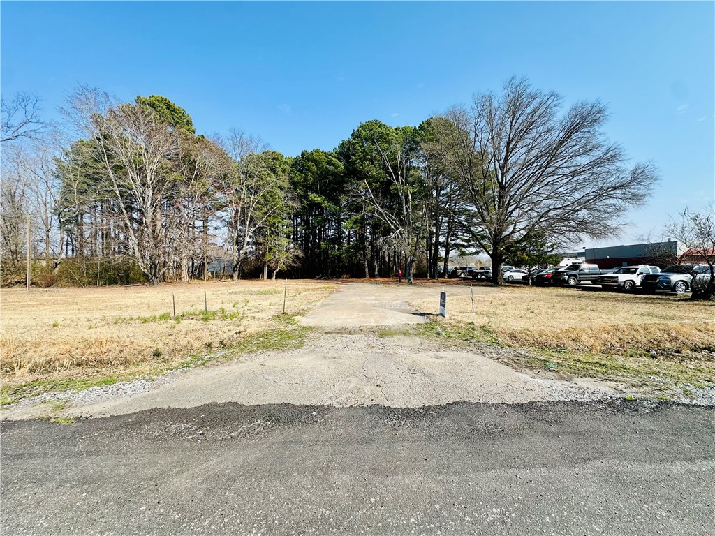 Gravel driveway providing access to a partially wo