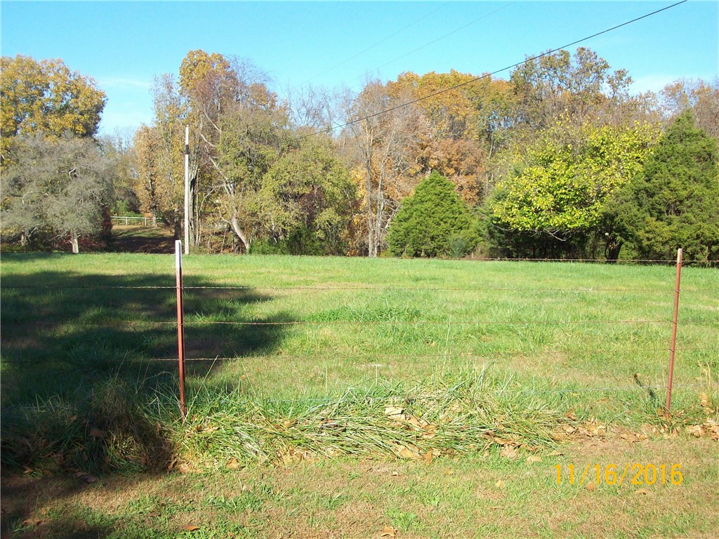 Build your dream home and still have room for horses or cattle. There are several excellent building sites and you would only be about 4 miles from Hwy 71 and the new I-49 roundabout. Call agent for showing.