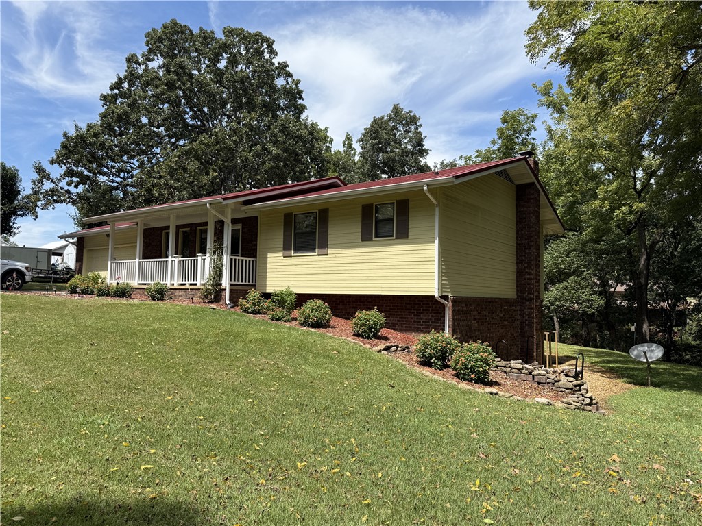Charming Home in a Quiet Cul-de-Sac! Welcome to this spacious 3 bedroom, 2.5 bath home tucked away in a peaceful cul-de-sac in Harrison. Built in 1986, this property offers both comfort and function with multiple living spaces and a versatile workshop. Main Level Features: Inviting covered front porch perfect for morning coffee, Comfortable living room, dining area, and kitchen, Primary suite with private bath & walk-in closet, additional bedroom and full bath, covered deck overlooking the backyard, Basement Retreat, large family room with cozy wood-burning stove, half bath, bedroom and utility room with bonus office space. Detached 20ā x 24ā heated & cooled workshopāideal for hobbies or storage,
Low-maintenance vinyl siding with brick accents, Durable metal roof. This home is a rare find in a quiet neighborhood and offers plenty of space inside and out for family living, entertaining, and projects.