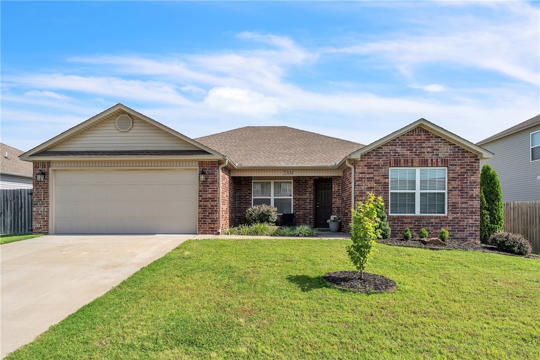 An absolutely gorgeous home that is perfect for you and your family just became available in the center of Northwest Arkansas, so a phenomenal location. It all starts out front with the beautiful landscaping that takes you to your new front door. Open the door and you are greeted by luxury vinyl plank flooring in the expansive living room with plenty of room for the family. From there venture on to the modern kitchen featuring white cabinets, granite counters, raised granite bar top, pantry, all stainless appliances including a fridge and a dining area with a built in bench for ease of seating. The large primary bedroom has an ensuite with big shower and a great walk-in-closet. Two more bedrooms for the kids opposite the adults and a second bathroom allow privacy. Up front is a forth bedroom or an office if you work out of the house. Laundry room has both washer and dryer conveying with home. Relax out back under the pergola surrounded by a privacy fenced flat backyard that is perfect for the kids and pets to play.