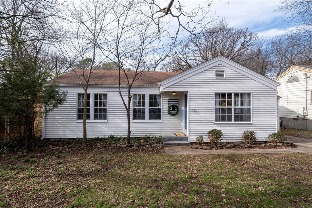 2 Doors from Wilson Park! Walk to class, Bicycle Trail, Dickson Street! Beautiful 3 bedroom right in the heart of Fayetteville. Updated kitchen includes new cabinets, butcher block counters, subway tile backsplash. New paint throughout home. Wilson Park has tennis courts, playgrounds, swimming pool, and softball field! Laundry connection, 1 car attached garage, and a big backyard! Currently staged, price reflects unit without furniture. Furnishings could be negotiated. Available NOW!