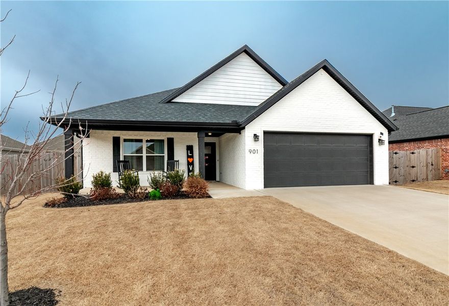 Stunning 4-bedroom, 2-bath all-brick home in a convenient location! Enjoy easy access to shopping, dining, HWY 112, HWY 412, and I-49, while still maintaining a peaceful country feel! Inside, you’ll find beautiful hardwood floors, a spacious open/split floor plan, and a well-equipped kitchen featuring a large island, granite countertops, stainless steel appliances, tiled backsplash, shaker-style cabinets, pantry, and more. The exterior offers modern white brick with black accents, covered front and back porches, a spacious fenced-in backyard, and well-manicured yard & landscaping. Located in the Hickory Meadows Subdivision, this home includes access to a large community pool, huge covered pavilion, playground, greenspace, and sidewalks throughout. Brand new roof less than 6 months old!  4th bedroom currently set up as an office.