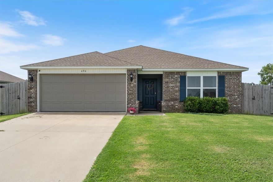 BUYERS FINANCING FELL THRU! BACK ON MARKET AT NO FAULT OF SELLER- RD Eligible! Whether you're downsizing, buying your first home, or seeking a fantastic investment property, this like-new 3 bedroom, 2 bath home w/ a modern feel is a must-see! Step into the open-concept layout featuring luxury vinyl plank flooring & a kitchen w/ stainless steel appliances that flows effortlessly into the spacious, light-filled living room. The cozy eat-in dining area is ideal for family dinners or game nights. Two bright, roomy bedrooms are located just before the private primary suite, which boasts tray ceilings, space for a sitting area, a full ensuite bath, and a large walk-in closet.Outside, enjoy entertaining on this corner lot with a fully fenced yard & dual gate access on both sides of the home—perfect for convenience and privacy. Situated near the Siloam Springs Aquatic Center & only minutes from charming downtown Siloam Springs. Just 30 minutes to Fayetteville & 20 miles to XNA Airport—this home combines comfort & location.