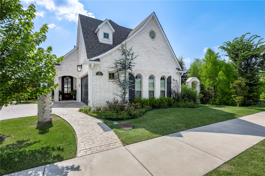 This charming Cottage-style home in the Brooklands Subdivision offers a unique & luxurious living experience with countless upgrades and custom features. The attention to detail is evident throughout, from the Carrara marble guest bath & kitchen backsplash to the Jennair Pro-Style range & dishwasher. Another highlight is the back patio & upstairs deck, where you can witness breathtaking sunsets over the neighborhood lake that is stocked for neighborhood fishing enthusiasts. The community pool & playground are also just steps away. To truly appreciate the craftsmanship of this home, it is a must-see in person.