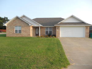 Custom Built Beautiful Home!Tile floors ,carpet in bedrooms.Spacious living with trey ceiling, open to dining & kitchen for entertaining .Lots of extra cabinets in the kitchen w/built in desk area & laundry room!Master features a cathedral ceiling,ex-large walkin closet & roomy master bath.Covered back porch,5,000 sprinkler system on a lovely corner lot.