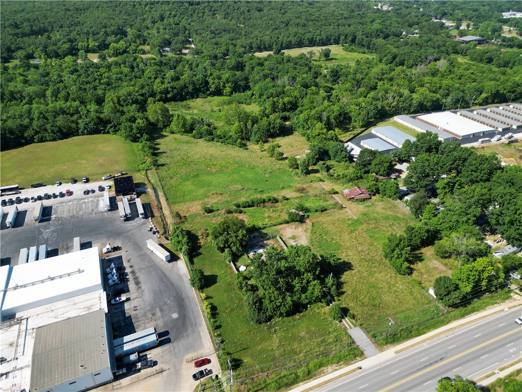 Prime Development land in the Heart of Fayetteville 8.9 Acres Zoned Downtown General & R-A 8.9± acres of flat land located w/n the city limits of Fayetteville offering unbeatable access, flexibility, and investment potential. Positioned within a designated Opportunity Zone, this property opens the door to significant federal tax incentives for long-term investors and developers.Walker Park is set to receive a $3 million revitalization, adding pickleball courts, a climbing area, a new playground, and a dog park. Just to the south, a 23-acre nature-based retreat has been announced by the Barnaby Group designed to bring a wellness-focused hospitality experience to the area.Combined w/new residential developments off 15th St, this area is rapidly transforming into Fayetteville’s most vibrant growth corridors Features:High Visibility & Access Excellent road frontage Strategic Location: Adjacent to Walker Park& minutes from the Art’s District UoA bike trails & the planned nature-based hospitality development on 19th St