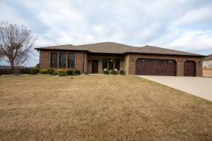 Beautiful house on the golf course with double garage & single golf cart garage; house backs up to hole 16- 16th Tee box; high end stainless steel appliances; whole house generator; large master bedroom with sitting area; French doors open onto covered patio; new kitchen island with granite countertop; landscaped yard; owners have added a lot of features to their home that was purchased new; new tankless water heater