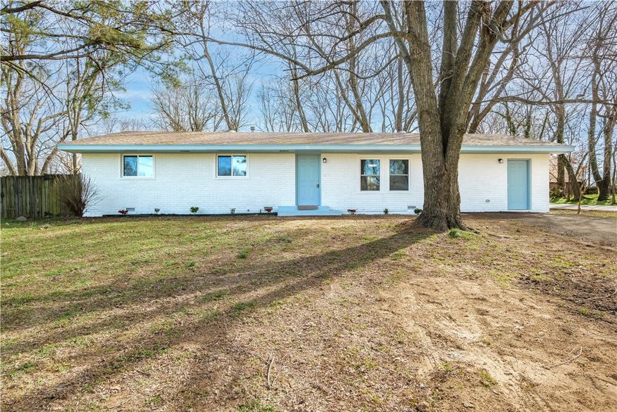 Great location right close to Battlefield Park, five miles from I-49 and Fayetteville, with a great park across the street. This home is much better than a brand-new one in that it is much less expensive, and the house itself has been renovated to its fullest extent; it's like a brand-new home in many ways. Four bedrooms and one and a half bathrooms. Everything new: roof, crawl space, walls, paint, flooring, microwave, stove, water heater, HVAC-A/C unit, etc. It smells brand new! It has a huge quarter-acre lot with a great ample backyard, mature trees, and much more. The Prairie Grove Outlots Subdivision, which is well established, is very secure and tranquil in all surroundings, with low traffic on the front road. The extra room has an independent front door and was entirely made into a massive fourth bedroom with a separate Mini-Split unit. This could be used as a rental or AirBNB  to bring some extra cash for the family!