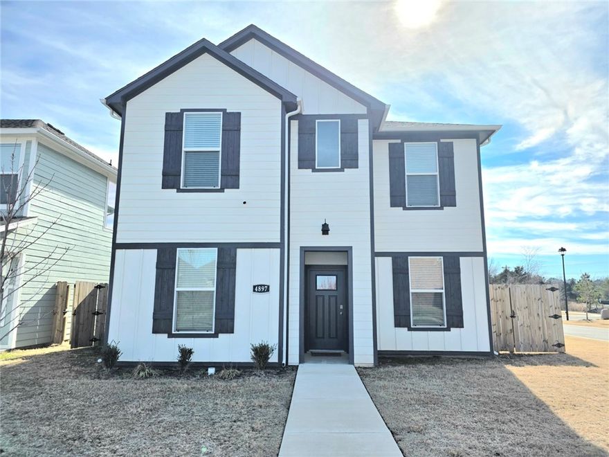 Welcome to this fully furnished, stunning 3-bedroom, 2.5-bath craftsman-style home built in 2023, perfectly located in Fayetteville, just a short 10-15 minute drive to I-49 and the University of Arkansas. The active STR permit can transfer with the property. Offering 1,688 sq ft of thoughtfully designed living space, this home features an open-concept layout with durable LVP flooring throughout the main areas and cozy carpet in all bedrooms. The kitchen boasts quartz countertops, ample cabinet space, and a functional flow perfect for both everyday living and entertaining. Upstairs, you’ll find all three spacious bedrooms, including a comfortable primary suite with a private bath and walk in closet. Enjoy outdoor living year-round on the covered patio overlooking the backyard. With its prime location near shopping, dining, schools, and major commuter routes, this move-in ready, fully furnished home blends traditional charm with modern convenience. Don’t miss your chance to make this beautiful property yours!