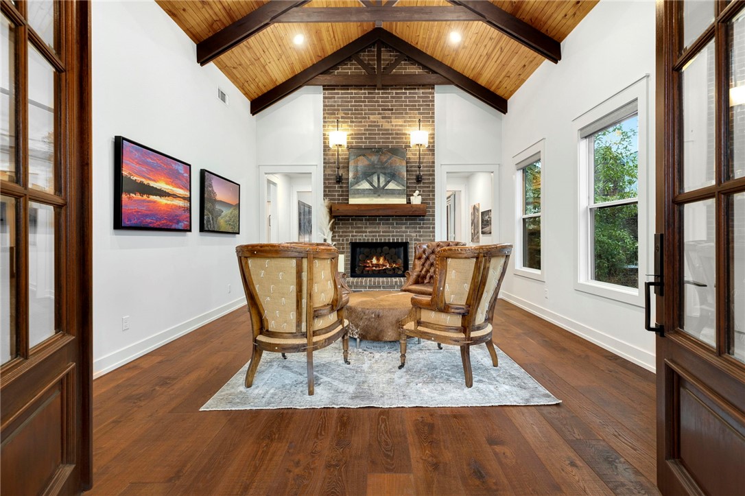Serene, peaceful, modern, elegant, to name a few. 4054 W Starry Night View is a hidden gem in NWA. Located in West Fayetteville, this custom home is complete with vaulted wooden ceilings, beams, built ins, 3 fireplaces, multiple patios, polished and natural granite, luxurious and modern finished, and custom details like the panoramic stacking doors that seamlessly open the living room to the pristine covered outdoor entertainment space. With 3 bedrooms, 2 bathrooms, a chefs dream of a kitchen, separate dining, office space, and a huge laundry room, this home will satisfy the most observant and meticulous buyer. Every detail from under cabinet lighting, soft close cabinets, pot filler, private patios, and native landscaping, no detail has been overlooked nor any want unfulfilled. This home is magazine worthy and is waiting for the next lucky buyer to call it their own. Don't wait, this home is one of a kind and is sure to impress.