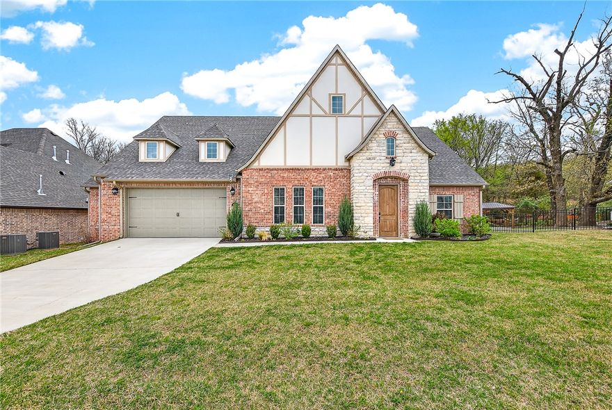 Welcome to this like-new, gently lived-in Fayetteville home offering a spacious, thoughtfully designed layout in a neighborhood where each home adorns its own unique character. The flexible floor plan features an upstairs en-suite bedroom or bonus room, while the large primary suite flows seamlessly from the bedroom to the bathroom, into a walk-in closet, and directly into the attached laundry room for everyday convenience. The stylish kitchen is both functional and inviting, complete with spacious walk-in pantry. Additional storage is abundant with expansive attic space and a garage bump-out for extra flexibility. Ideally located within biking or walking distance to Centennial Park, less than 10 minutes to the University of Arkansas, and with easy access to I-49, this home blends comfort, function, and prime Fayetteville living.