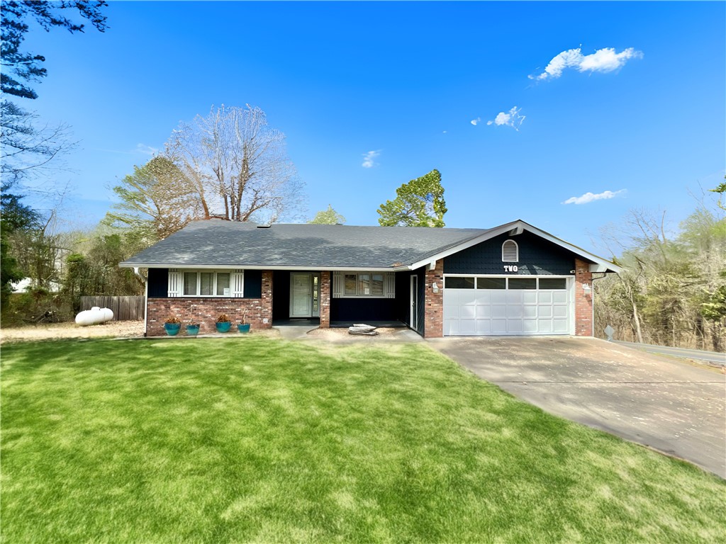 You will love this well-maintained home in the amenity-rich city of Bella Vista! Near golf courses, biking trailheads and two of the seven private lakes! Spacious split floorplan with an extra room with built-in storage that can be used as an office or craft room. The primary bath has a walk-in shower, jetted tub and a double vanity. The inviting family room, which features a vaulted ceiling, is open to the eat-in kitchen with extra seating at the large island. The peaceful covered deck overlooks a fully fenced backyard - ready for kids, pets, family or friends to gather. The heated and cooled unfinished basement makes a great workshop or storage area! Recent improvements include: 2022 HVAC, 2020 roof, and a 2019 water heater. All the hard work has been done! Close access to Hwy 71 gets you on the road quickly!