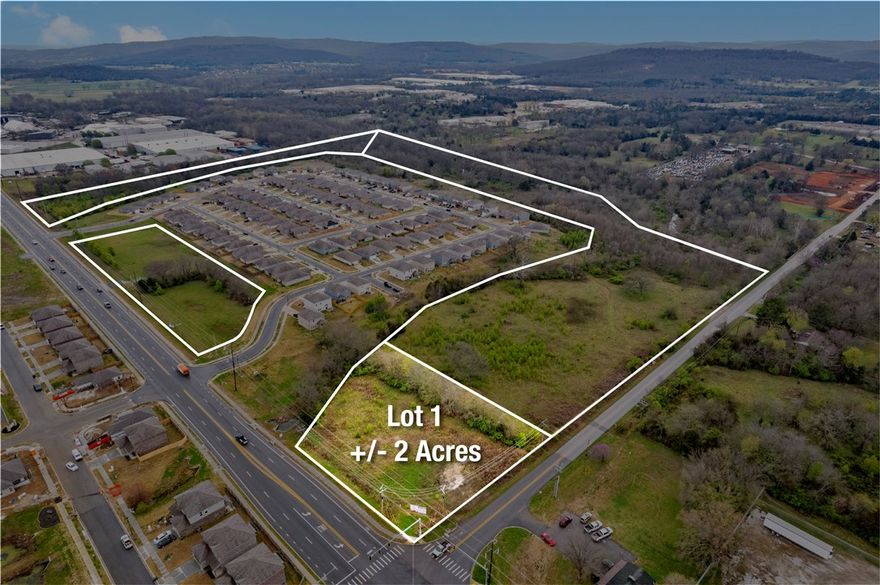 +/- 2 acres of LEVEL land situated prominently at the intersection of Morningside Dr and 15th St, which
sees +/- 18,000 VPD. Sewer, water, and electricity are all on-site. Positioned adjacent to a recently
constructed subdivision creating more potential customers for either a convenience store, gas station,
restaurant, retail development, or many other uses. This prime location presents an ideal opportunity for a gas station, given its strategic placement amidst established neighborhoods and its convenient
proximity, just a short 5-minute drive to Downtown Fayetteville and the University of Arkansas Campus.
This lot is zoned NC - Neighborhood Conservation. 'It has the least activity and lower density than other
zones. It is purely residential zone, however, it can have some mix of uses like civic buildings. The best
use would be a C-1, retail business, convenience store, QSR (Quick service Restaurant), Drive-thru
business, etc.'