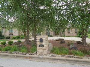 This beautiful custom built home backs up to the course with a beautiful view. Featuring floor to ceiling windows in the hearth room, 12 ft ceilings, gorgeous kitchen with lots of amenities. 3 bedrooms and 3 and 1/2 baths. Large bonus room upstairs with bath. This is a must see!