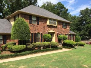 The home rests graciously and beautifully on a large lot in a quiet neighborhood in the west end of town. Besides a great living space with 4 bedrooms, 2.5 baths, formal dining and large great room, you will find a 320 sq ft detached office/play house, an in ground pool, deck, fire pit and fenced backyard. This property has great features inside and out!