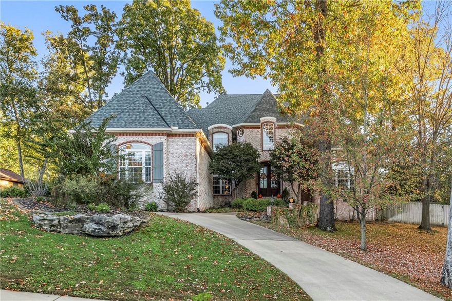 Stunning North Bentonville Estate in Hanover! Executive neighborhood and prime location with direct access to trail connections for biking and walking!   Gorgeous Traditional Home with Incredible architectural details throughout including a two-story formal living room with open wrap-around stairs. Updated chef’s kitchen open to the cozy Keeping Room featuring one of 3 fireplaces throughout the home. Master Suite, Private office, Formal Dining on main level. Upstairs 3BRs 2BA, Living Area (with Fireplace)with access to outdoor private balcony. Tons of storage (700 sq feet attic space with AC/Heat that could be finished out).   Mature, landscaped .46-acre lot with fenced yard and play area.  Established and Treasured North Bentonville Neighborhood in prime location-3 min to I-49, 5 min to Downtown Bentonville, Crystal Bridges, and the Walmart Home Office.