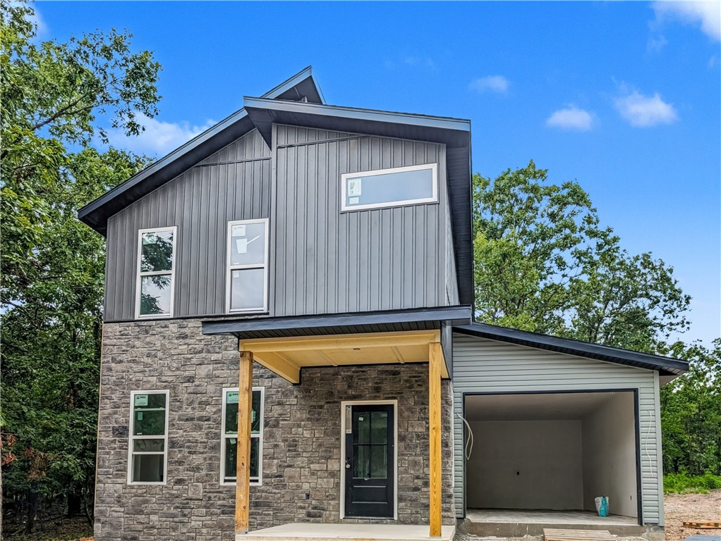Welcome To Your Next Home! This Beautiful New Construction In Bella Vista Is The Perfect Blend Of Modern Design And Everyday Function. The Main Level Features 9-Foot Ceilings And An Open Living Area That Flows Effortlessly Into The Kitchen. The Cozy Fireplace With Detailed Trimwork Becomes The Focal Point Of The Living Room, Creating A Warm And Inviting Atmosphere. The Kitchen Is Equipped With Custom Cabinets And 3CM Granite Countertops, Making It A Space Designed For Both Style And Function. The Dining Area And A Convenient Half Bath Complete The First Floor. Upstairs, Also Featuring 9 Foot Ceilings, The Primary Suite Offers A Spacious Retreat With A Dual Vanity And A Full Custom Tile Shower In The En-Suite Bath. Two Additional Bedrooms, A Full Hall Bath, And A Laundry Area Complete The Upper Level. Outside, The Back Patio Leads To A Flat, Usable Backyard—Ideal For Outdoor Enjoyment. Branchwood Rec Center And Trails Close By. This Home Has Everything You Need—Come See It Today!