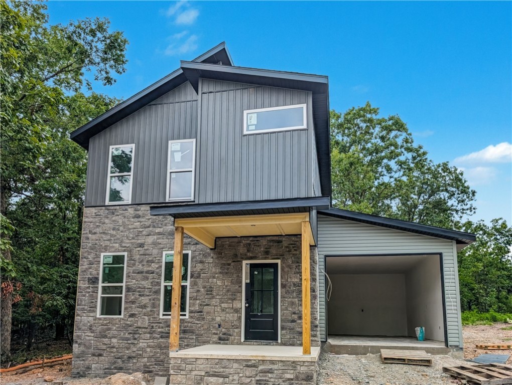Welcome To Your Next Home! This Beautiful New Construction In Bella Vista Is The Perfect Blend Of Modern Design And Everyday Function. The Main Level Features 9-Foot Ceilings And An Open Living Area That Flows Effortlessly Into The Kitchen. The Cozy Fireplace With Detailed Trimwork Becomes The Focal Point Of The Living Room, Creating A Warm And Inviting Atmosphere. The Kitchen Is Equipped With Custom Cabinets And 3CM Granite Countertops, Making It A Space Designed For Both Style And Function. The Dining Area And A Convenient Half Bath Complete The First Floor. Upstairs, Also Featuring 9 Foot Ceilings, The Primary Suite Offers A Spacious Retreat With A Dual Vanity And A Full Custom Tile Shower In The En-Suite Bath. Two Additional Bedrooms, A Full Hall Bath, And A Laundry Area Complete The Upper Level. Outside, The Back Patio Leads To A Flat, Usable BackyardāIdeal For Outdoor Enjoyment. Branchwood Rec Center And Trails Close By. This Home Has Everything You NeedāCome See It Today!
