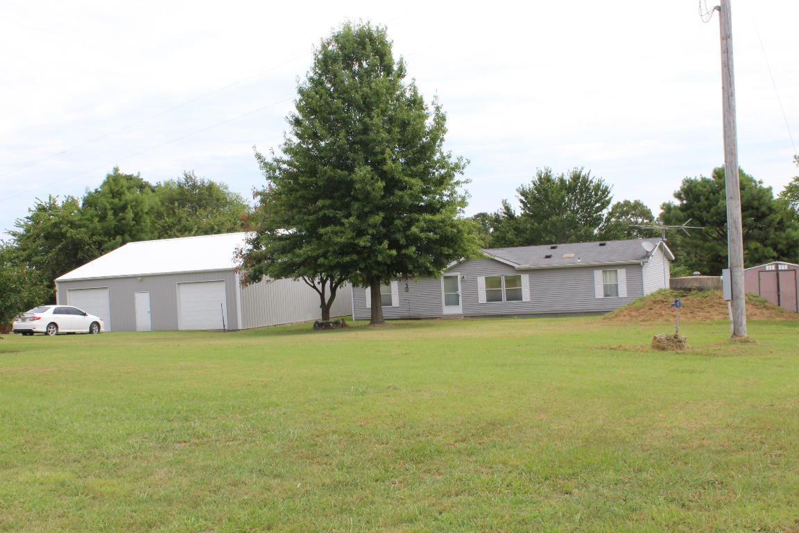 Property did not sell at auction has converted to a traditional listing Nice manufactured home with open floor plan. Rural setting on dead end road. Very nice 40x40 shop with electric and two electric garage doors. Shop has 10 x 40 covered patio for enjoying the outdoors and is very close to the home.