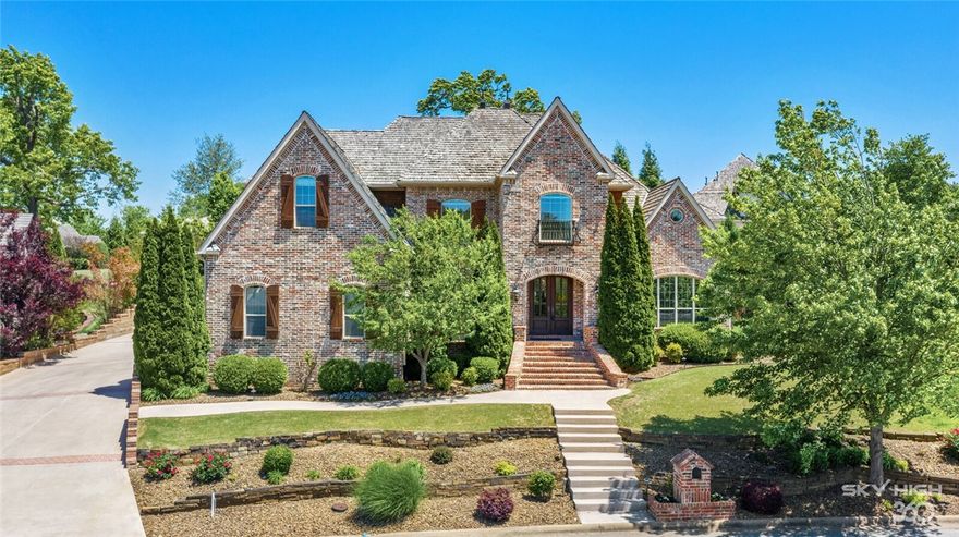 Perfectly positioned luxury home in PCC can have you on the golf course, tennis courts, pool or playground in under 2 minutes! Live life to the fullest in this newly updated elegant property offering 5 or 6 bedrooms, 5.5 bathrooms, 2 laundry rooms and an outdoor entertaining paradise! Bright, spacious layout w/3 living areas on main floor, private home office & GORGEOUS Chef’s kitchen featuring built in SS refrigerator, new quartz countertops, gas range & 2 pull out freezer/warming drawers.  Each bedroom suite boasts huge walk-in closets & private bathrooms! Bonus room & theater room too! 
Imagine entertaining on your very own regulation sport court for tennis or BB, along w/hot tub, grilling area & outdoor FP. Bentonville Schools, w/bus service on your street!