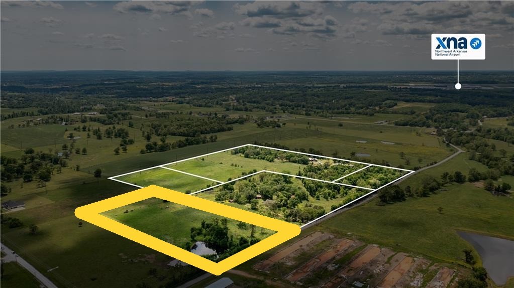 This 6.9 acres is located minutes from key Northwest Arkansas destinations: 12 minutes to Pinnacle Hills area, 15 minutes to Interstate access, 20 minutes to Downtown Bentonville, and Quick access to XNA Airport. Despite its convenience, the property offers a peaceful, rural atmosphere perfect for those seeking space to enjoy nature and build a home on an estate size lot. Chicken houses across road have been torn down. Whether you're looking for a serene home site or a smart investment opportunity, this land is a rare find in a rapidly growing area. It is also listed with a 47 acre parcel MLS#1307911.
